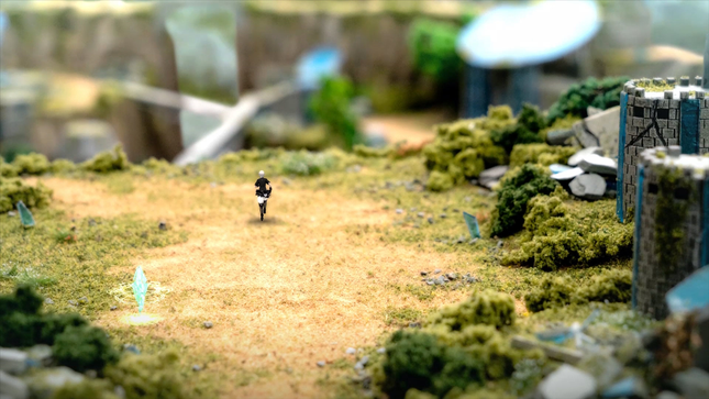 A character runs around a diorama-like environment.